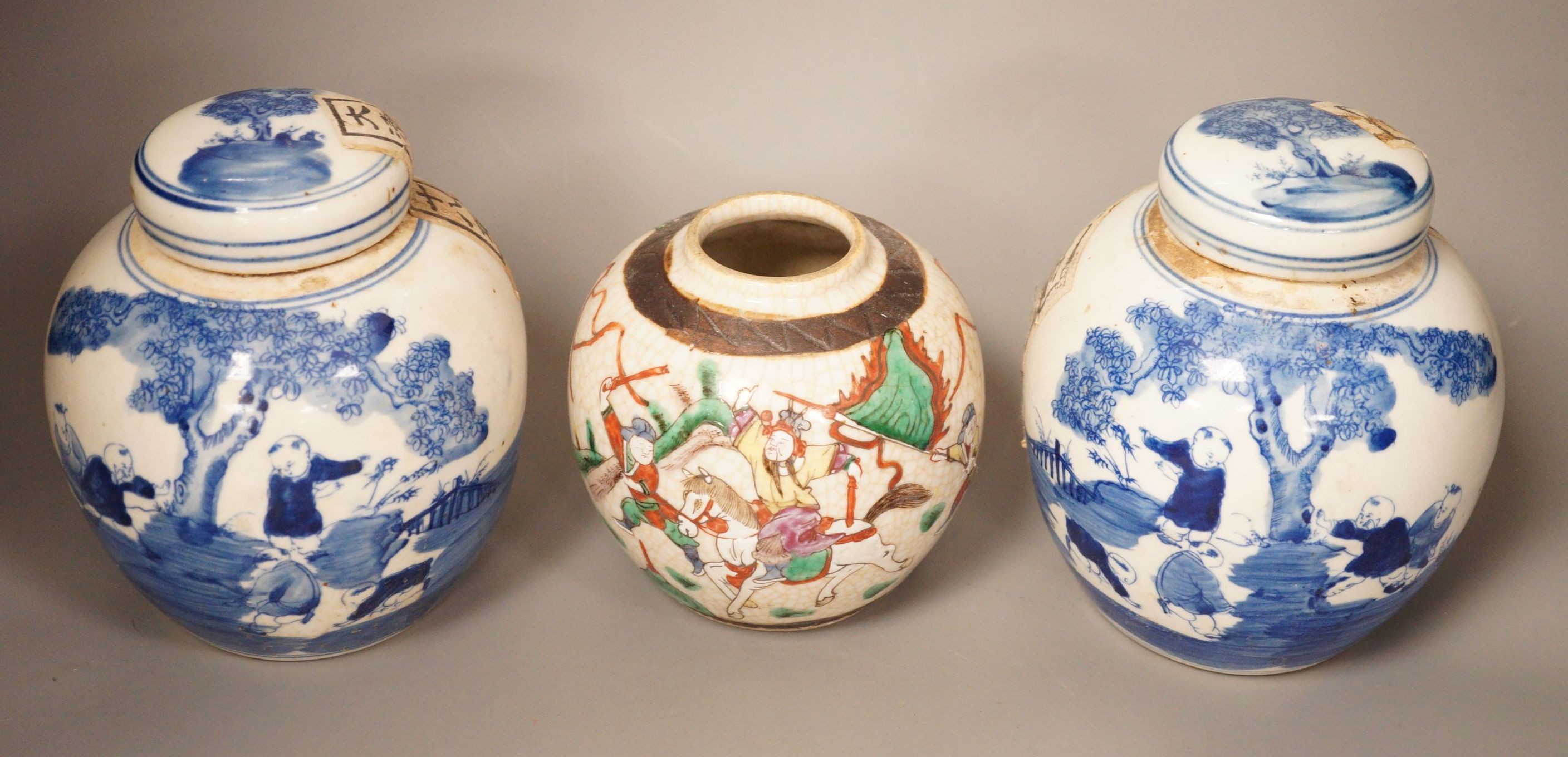 A Chinese crackleglaze famille rose jar and two blue and white jars, 16cm